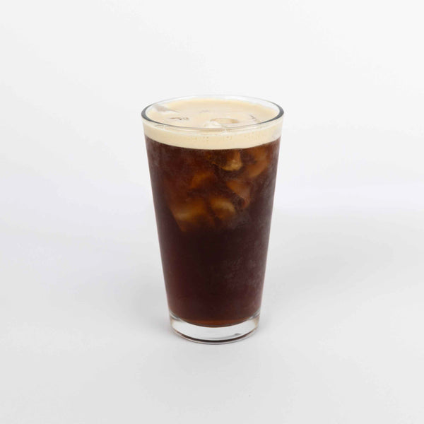 Glass of iced coffee with a white background