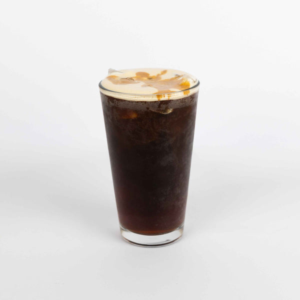 Cold brew in a glass on a white background