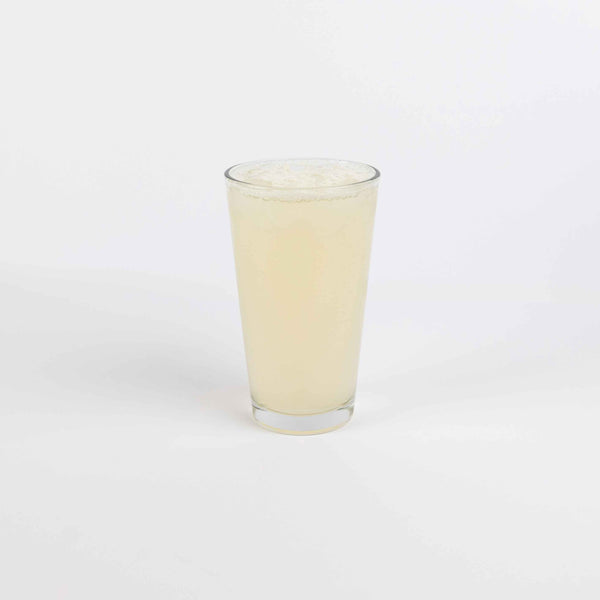 Lemonade in a glass on a white background