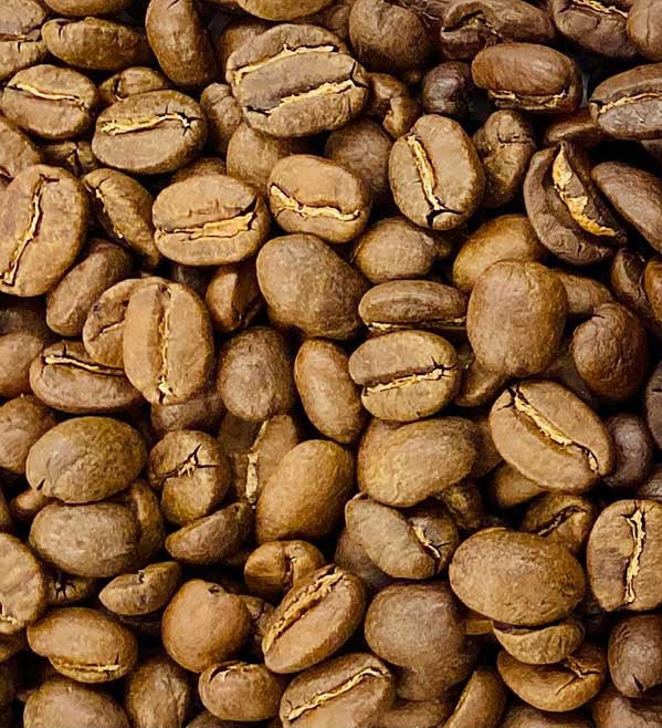 Three different grades of coffee beans arranged in a gradient from light to dark.